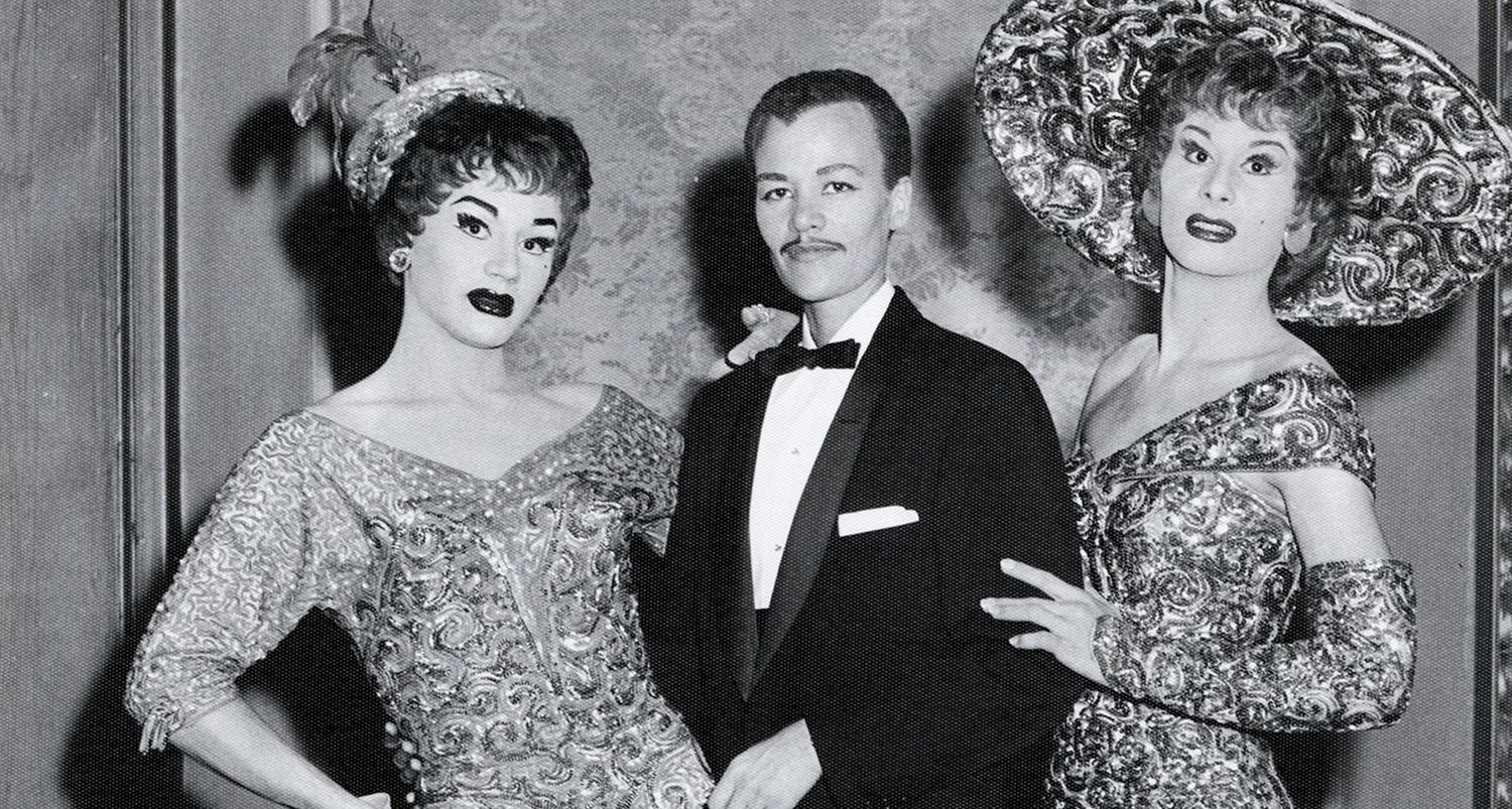 A black and white photograph of DeLarverie, center, next to two people in elegant feminine attire and makeup. Photo Source: Stormé DeLarverie Photographs, Photographs and Prints Division, Schomburg Ce