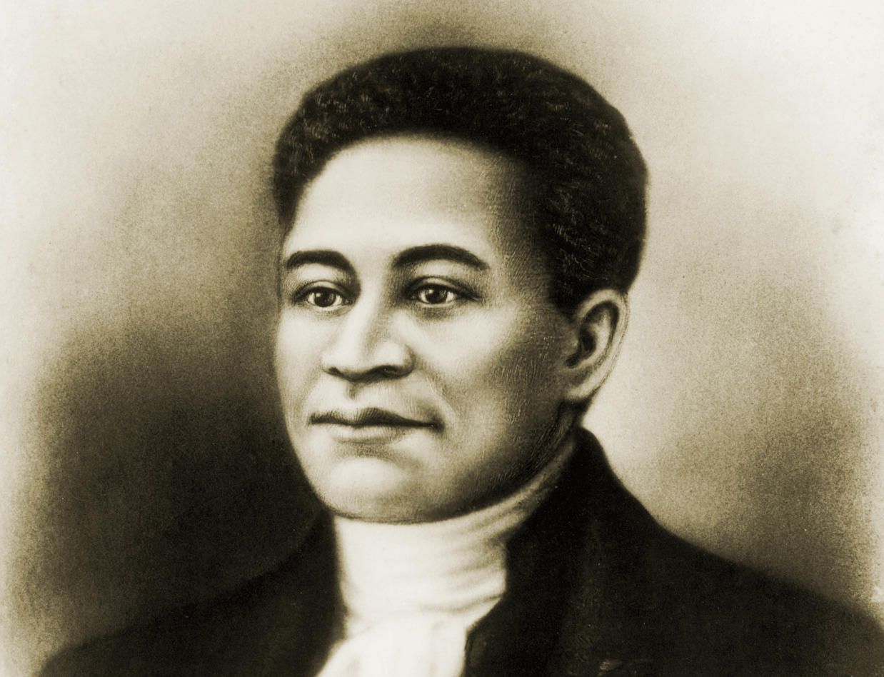An illustrated portrait of Crispus Attucks wearing a dark jacket and white high necked shirt with a solemn expression. Image Source: Crispus Attucks Museum