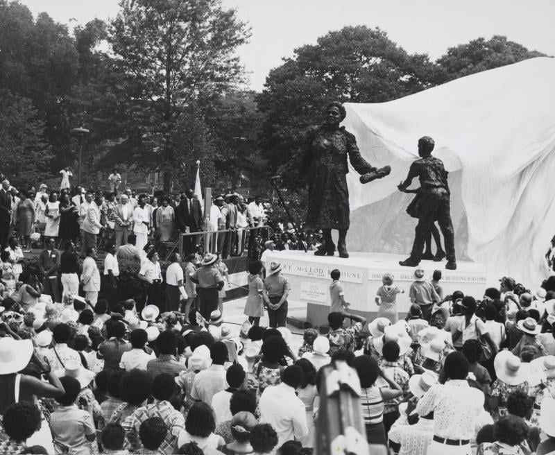 A black and white photograph of a crowd gathering around the unveiling of the Mary McLeod Bethune statue in Washington, DC’s Lincoln Park in 1974. Photo Source: Library of Congress