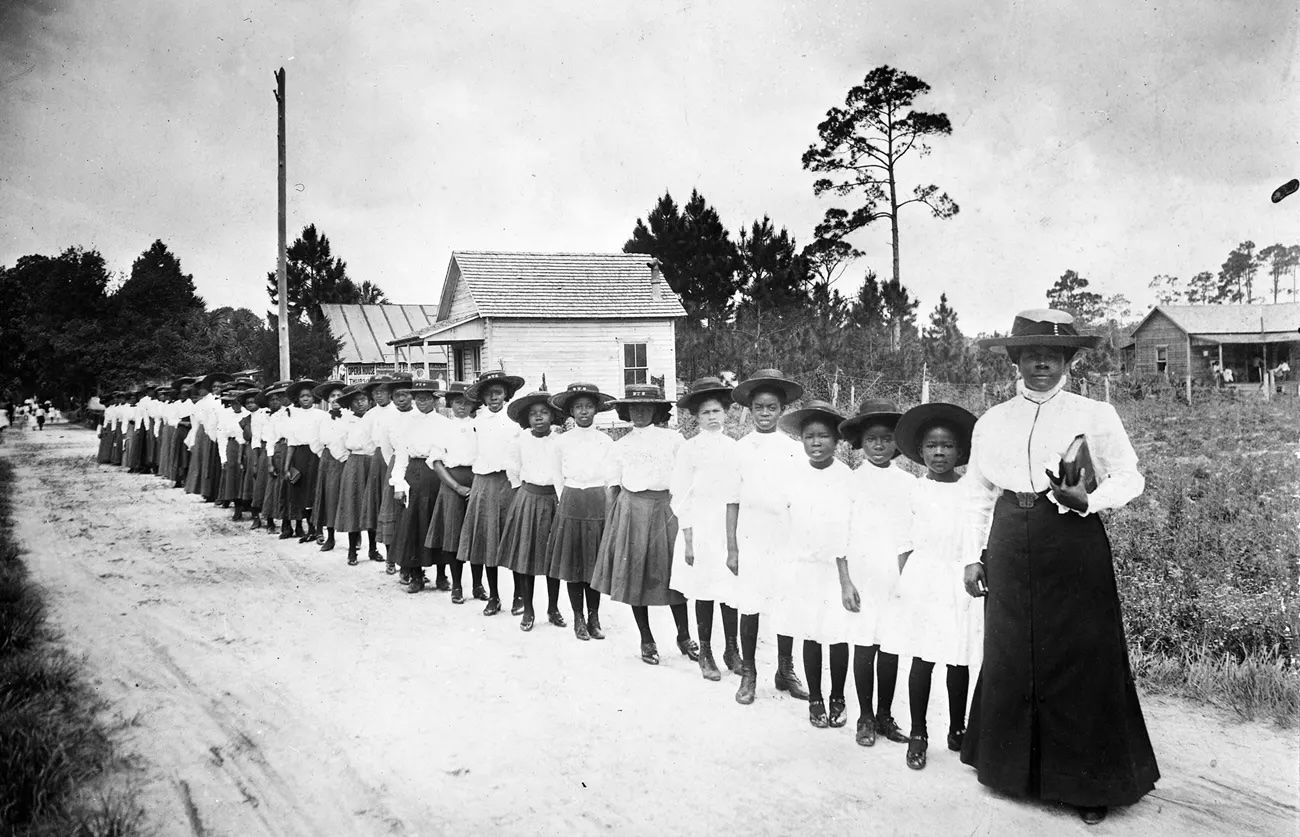 Pioneering American educator and civil rights leader Mary McLeod Bethune with her students at the one-room schoolhouse she founded, the Daytona Normal and Industrial School for Negro Girls, 1905. Phot