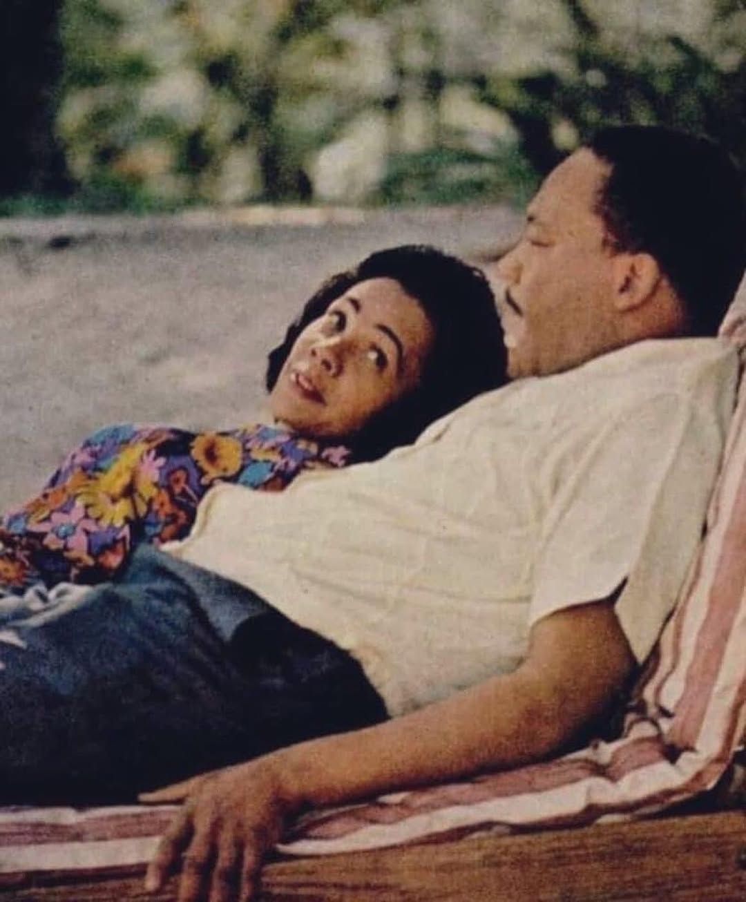 Color photo of Coretta and Martin Luther King on vacation in Jamaica. Both are reclining casually on pool chairs, and Coretta is looking lovingly at her husband. Photo Source: Bernice King on Facebook