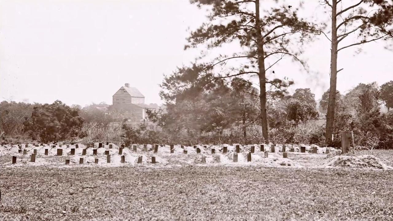 A black and white image of the new graves created by the Black community in the race track, taken sometime in 1865. Image Source: Library of Congress