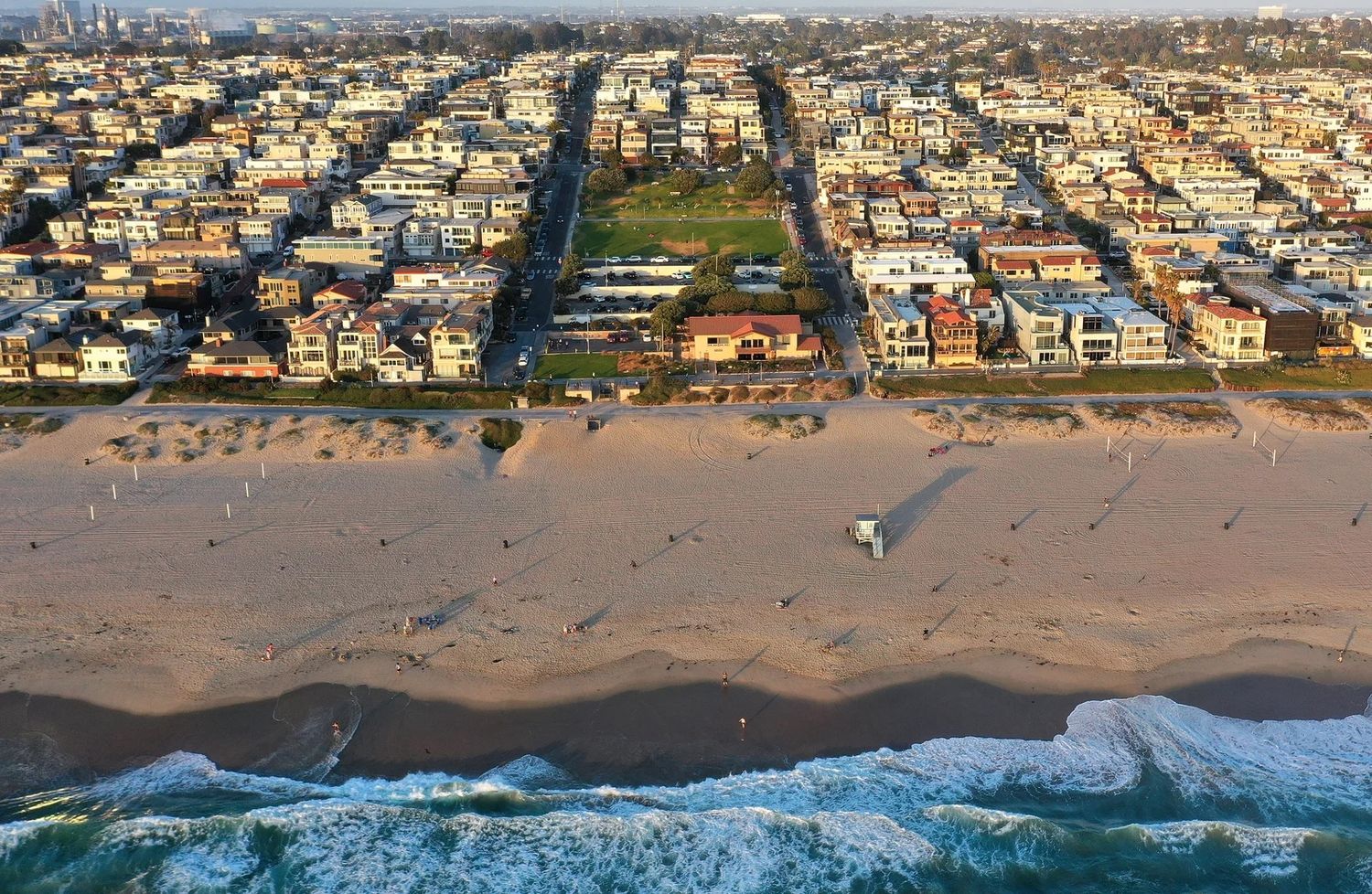 A photograph showing an aerial view of Bruce's Beach, which is wedged between expensive real estate on April 19, 2021 in Manhattan Beach, California. Photo Source: Mario Tama/Getty Images via NPR